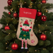 Christmas stocking with embroidered name and Christmas figurines