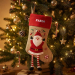 Christmas stocking with embroidered name and Christmas figurines
